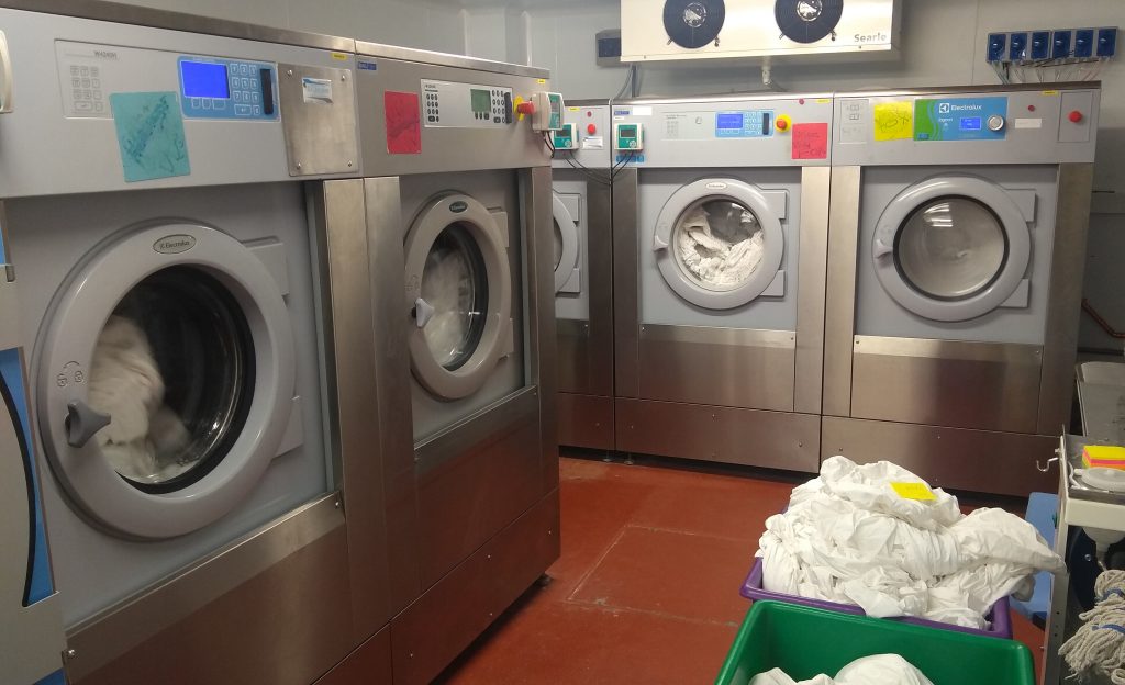 Five Commercial Washing Machines in commercial laundry